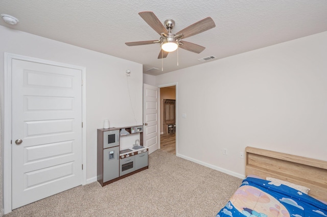 5378 Wyndell Cir, Crestview, FL 32539 - unfurnished bedroom featuring light colored carpet, baseboards, a ceiling fan, and a textured ceiling