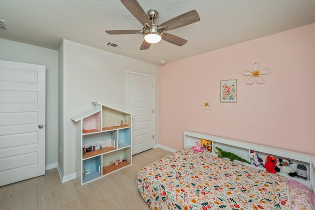5378 Wyndell Cir, Crestview, FL 32539 - bedroom with wood finished floors, baseboards, and a ceiling fan