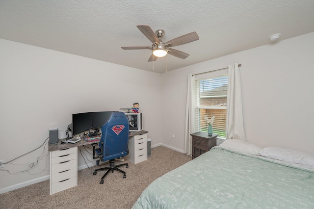 5378 Wyndell Cir, Crestview, FL 32539 - bedroom with light colored carpet, baseboards, a desk, ceiling fan, and a textured ceiling