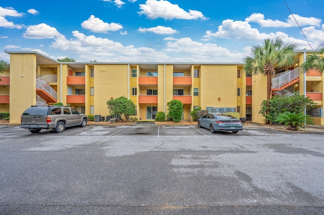 209 W Miracle Strip Pkwy Unit C 202, Mary Esther, FL 32569 - view of apartment building / complex with uncovered parking