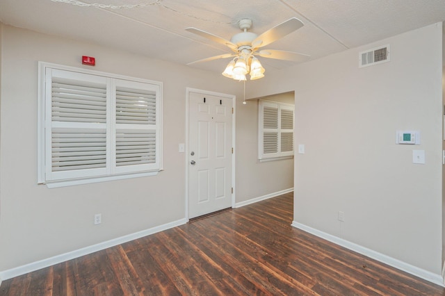 209 W Miracle Strip Pkwy Unit C 202, Mary Esther, FL 32569 - unfurnished room featuring wood finished floors, baseboards, and ceiling fan