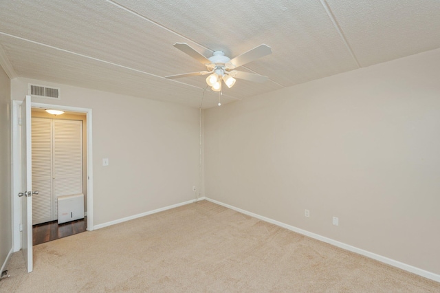 209 W Miracle Strip Pkwy Unit C 202, Mary Esther, FL 32569 - unfurnished room featuring carpet, ceiling fan, baseboards, and a textured ceiling
