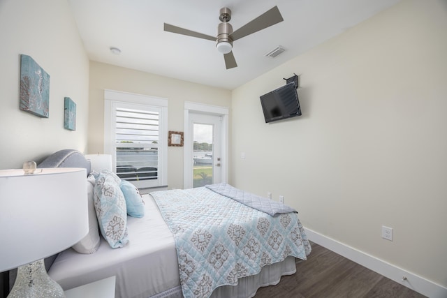 340 Bluefish Dr Unit 106, Fort Walton Beach, FL 32548 - bedroom featuring dark wood-style flooring, baseboards, and a ceiling fan