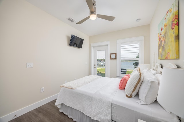 340 Bluefish Dr Unit 106, Fort Walton Beach, FL 32548 - bedroom with dark wood-style flooring, a ceiling fan, and baseboards