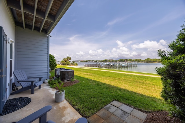 340 Bluefish Dr Unit 106, Fort Walton Beach, FL 32548 - view of green lawn with a water view and central AC
