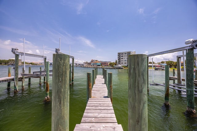 340 Bluefish Dr Unit 106, Fort Walton Beach, FL 32548 - dock featuring boat lift and a water view
