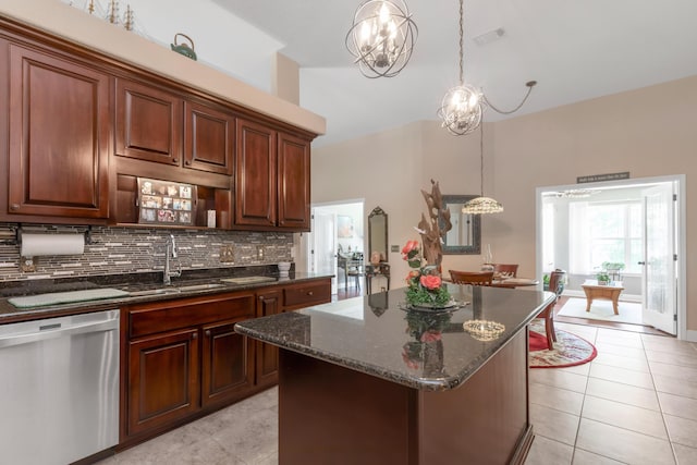 6202 Plum Orchard Way, Crestview, FL 32536 - kitchen featuring stainless steel dishwasher, a sink, light tile patterned floors, decorative backsplash, and a chandelier