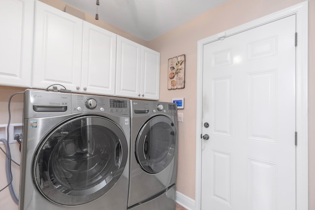 6202 Plum Orchard Way, Crestview, FL 32536 - washroom featuring cabinet space, washing machine and clothes dryer, and baseboards