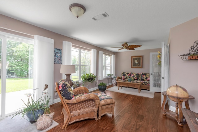 6202 Plum Orchard Way, Crestview, FL 32536 - living room featuring healthy amount of natural light, dark wood-type flooring, ceiling fan, and baseboards