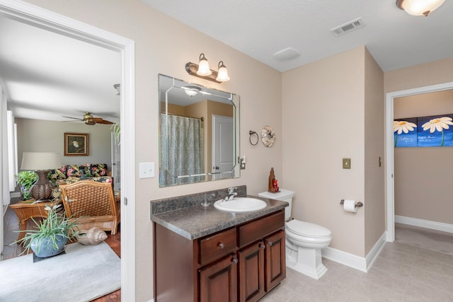 6202 Plum Orchard Way, Crestview, FL 32536 - full bath with vanity, toilet, tile patterned flooring, ceiling fan, and baseboards
