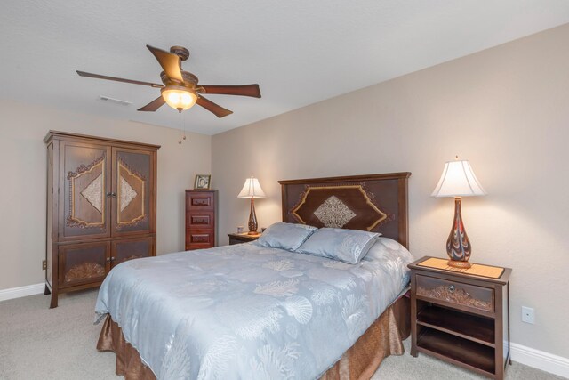 6202 Plum Orchard Way, Crestview, FL 32536 - bedroom featuring light carpet, baseboards, and a ceiling fan