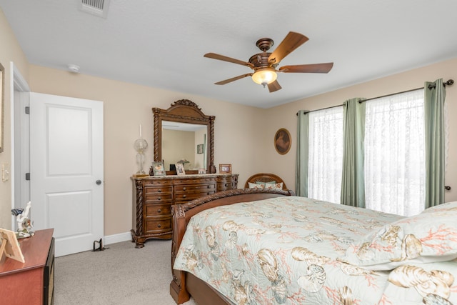6202 Plum Orchard Way, Crestview, FL 32536 - bedroom with light carpet, a ceiling fan, and baseboards