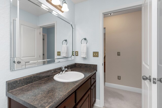 6202 Plum Orchard Way, Crestview, FL 32536 - bathroom featuring vanity and baseboards