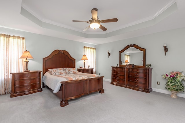 6202 Plum Orchard Way, Crestview, FL 32536 - carpeted bedroom featuring multiple windows, ornamental molding, a raised ceiling, a ceiling fan, and baseboards
