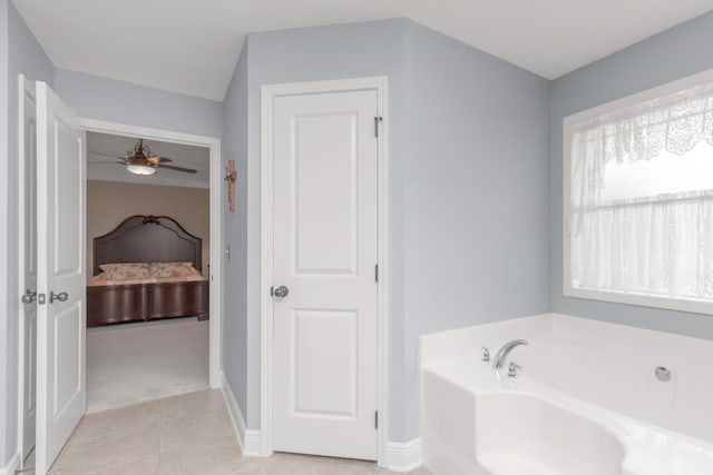 6202 Plum Orchard Way, Crestview, FL 32536 - full bath with connected bathroom, a bath, ceiling fan, tile patterned flooring, and baseboards