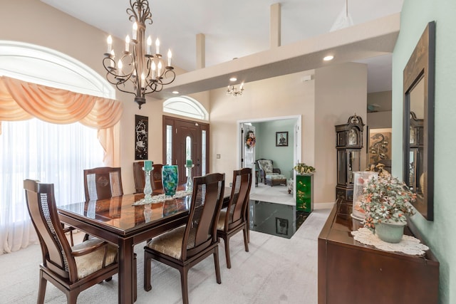 6202 Plum Orchard Way, Crestview, FL 32536 - dining area with light colored carpet, a chandelier, recessed lighting, and a towering ceiling