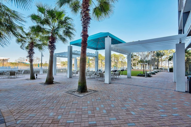 9860 S Thomas Dr Unit 726, Panama City Beach, FL 32408 - view of community featuring a pergola and outdoor dining area