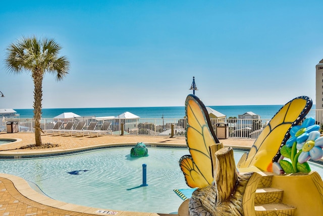 9860 S Thomas Dr Unit 726, Panama City Beach, FL 32408 - community pool featuring a water view, a water slide, and a patio