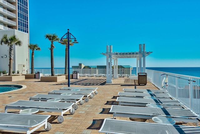 9860 S Thomas Dr Unit 726, Panama City Beach, FL 32408 - view of patio featuring a pergola and a water view