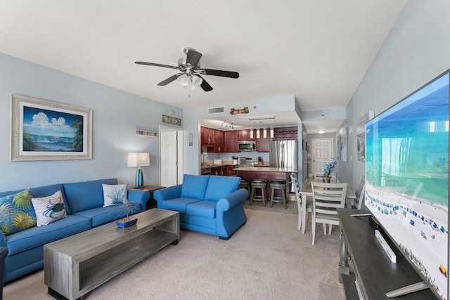 9860 S Thomas Dr Unit 726, Panama City Beach, FL 32408 - living room featuring light carpet and ceiling fan