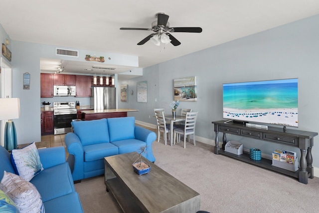 9860 S Thomas Dr Unit 726, Panama City Beach, FL 32408 - living room with ceiling fan, light carpet, and baseboards