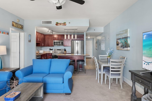 9860 S Thomas Dr Unit 726, Panama City Beach, FL 32408 - living room featuring light carpet, a ceiling fan, and baseboards