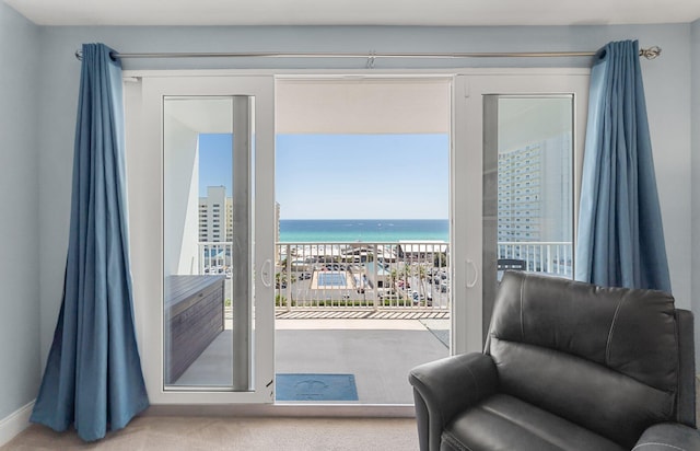 9860 S Thomas Dr Unit 726, Panama City Beach, FL 32408 - doorway featuring healthy amount of natural light, a water view, baseboards, and carpet floors