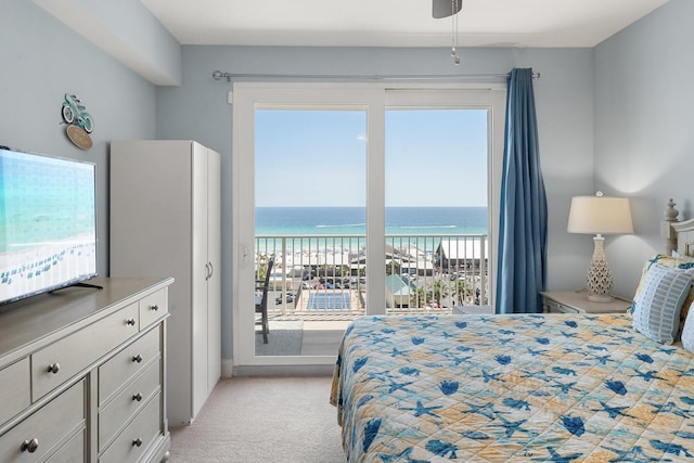 9860 S Thomas Dr Unit 726, Panama City Beach, FL 32408 - bedroom with light carpet and a water view