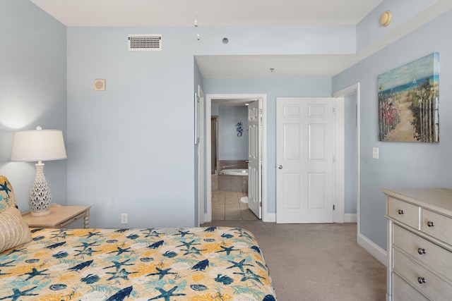9860 S Thomas Dr Unit 726, Panama City Beach, FL 32408 - carpeted bedroom with baseboards and connected bathroom