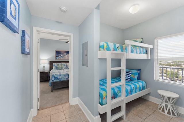 9860 S Thomas Dr Unit 726, Panama City Beach, FL 32408 - carpeted bedroom with electric panel, tile patterned flooring, and baseboards