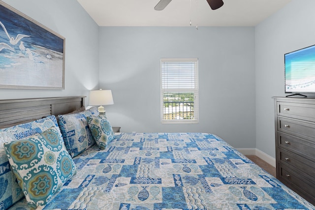 9860 S Thomas Dr Unit 726, Panama City Beach, FL 32408 - bedroom featuring baseboards and a ceiling fan