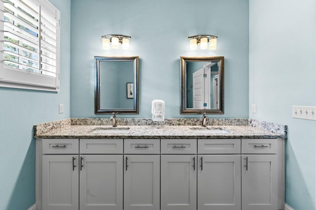 41 Bentley Ln, Santa Rosa Beach, FL 32459 - bathroom featuring double vanity and baseboards