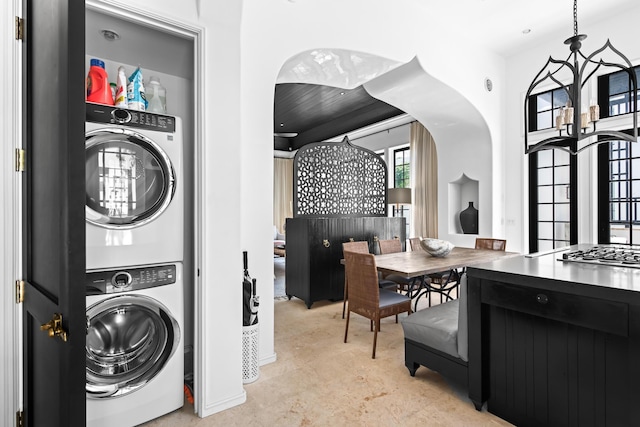 25 Moongate Ct, Inlet Beach, FL 32461 - laundry room with estacked washer and dryer and arched walkways
