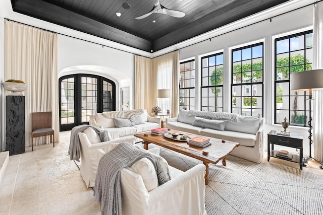 25 Moongate Ct, Inlet Beach, FL 32461 - living room featuring a high ceiling, a tray ceiling, arched walkways, ceiling fan, and wooden ceiling
