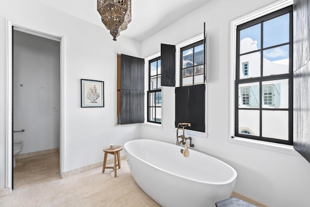 25 Moongate Ct, Inlet Beach, FL 32461 - bathroom with a freestanding bath, baseboards, and toilet