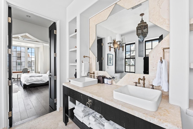 25 Moongate Ct, Inlet Beach, FL 32461 - full bath featuring built in features, double vanity, ensuite bath, and a chandelier