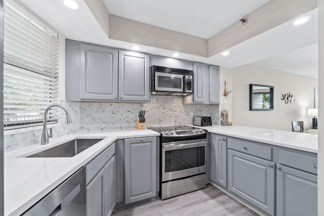4228 Beachside Two # 228, Miramar Beach, FL 32550 - kitchen featuring stainless steel appliances, gray cabinetry, a sink, and recessed lighting