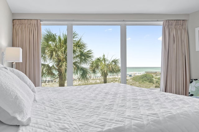 4228 Beachside Two # 228, Miramar Beach, FL 32550 - bedroom featuring a water view and multiple windows