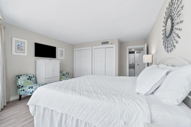 4228 Beachside Two # 228, Miramar Beach, FL 32550 - bedroom with two closets, light wood-style flooring, and baseboards