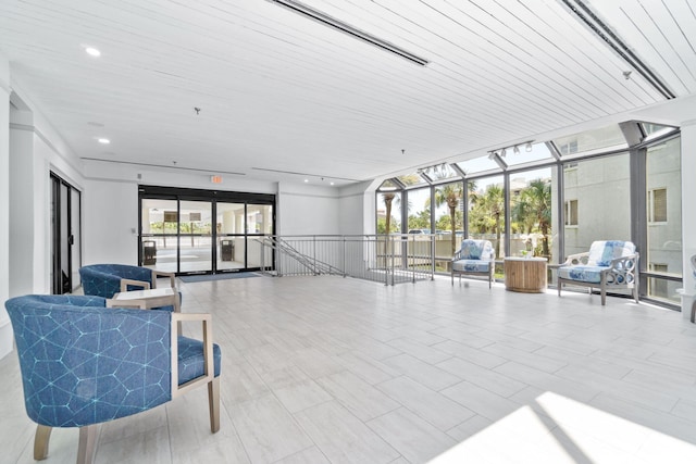 4228 Beachside Two # 228, Miramar Beach, FL 32550 - common area featuring expansive windows, a sunroom, wooden ceiling, and recessed lighting