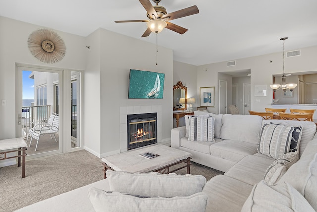 9011 W US Highway 98 # A-601, Miramar Beach, FL 32550 - carpeted living room featuring a tile fireplace, a ceiling fan, and baseboards