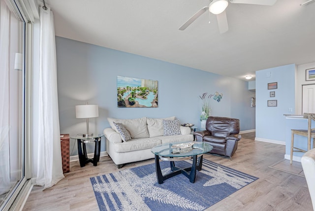 9900 S Thomas Dr Unit 2226, Panama City Beach, FL 32408 - living room featuring ceiling fan, light wood-type flooring, and baseboards