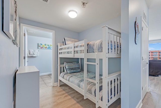 9900 S Thomas Dr Unit 2226, Panama City Beach, FL 32408 - bedroom with wood finished floors and baseboards