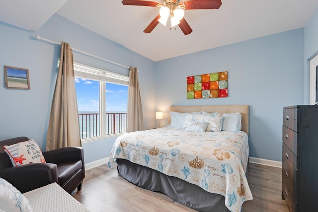 9900 S Thomas Dr Unit 2226, Panama City Beach, FL 32408 - bedroom with baseboards, wood finished floors, and ceiling fan