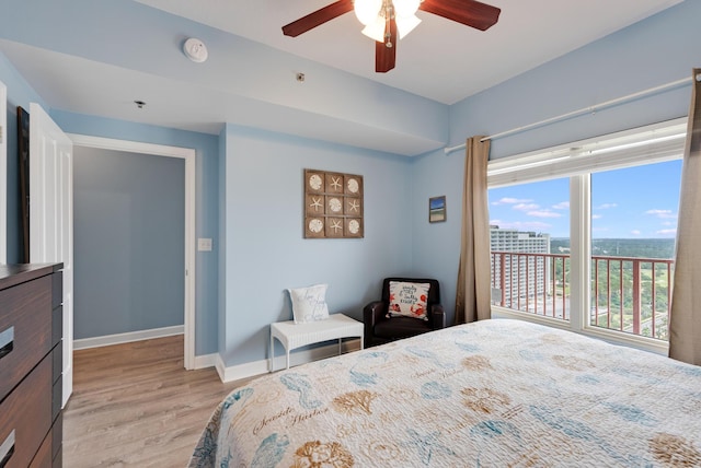 9900 S Thomas Dr Unit 2226, Panama City Beach, FL 32408 - bedroom featuring light wood-type flooring, baseboards, and a ceiling fan