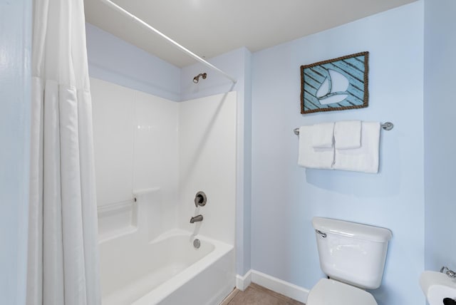 9900 S Thomas Dr Unit 2226, Panama City Beach, FL 32408 - full bathroom featuring shower / bath combination with curtain, baseboards, toilet, and tile patterned flooring