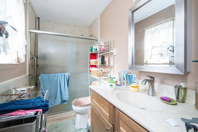 2522 Lake Silver Rd, Crestview, FL 32536 - full bath with vanity, toilet, a stall shower, and a textured ceiling