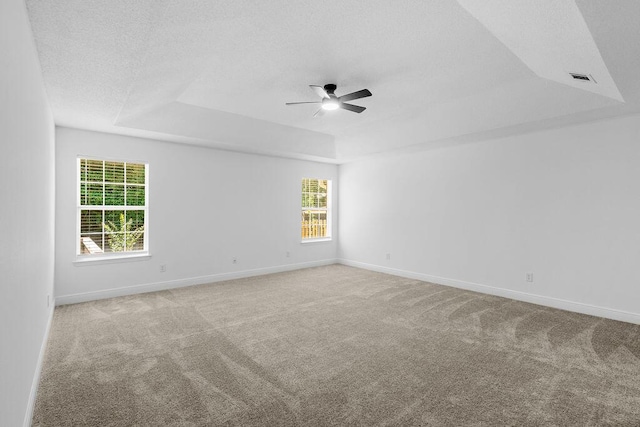 516 Vulpes Sanctuary Loop, Crestview, FL 32536 - carpeted empty room with a tray ceiling, a ceiling fan, baseboards, and a textured ceiling