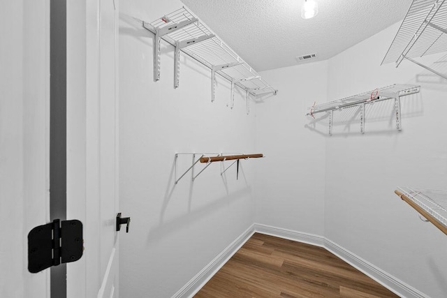 516 Vulpes Sanctuary Loop, Crestview, FL 32536 - spacious closet with dark wood-type flooring
