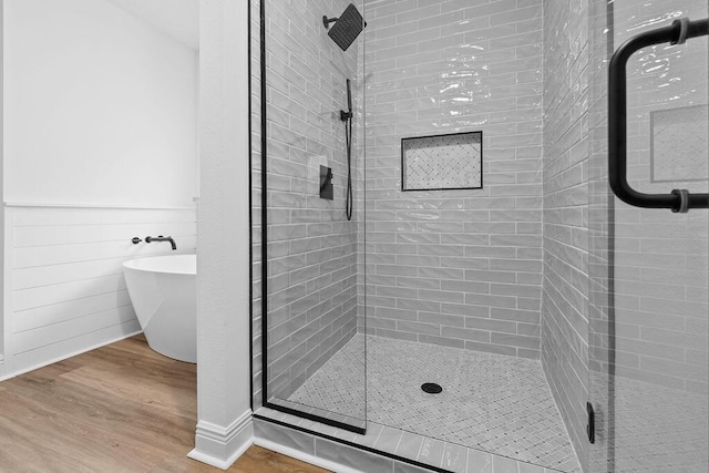 516 Vulpes Sanctuary Loop, Crestview, FL 32536 - full bathroom featuring a shower stall, wood finished floors, and a soaking tub